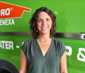 Woman standing in front of SERVPRO Fleet 